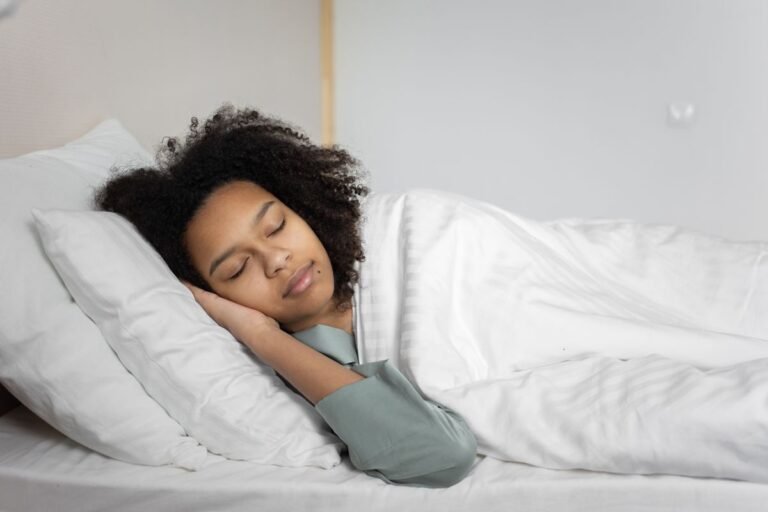 A serene scene of a woman with afro hair peacefully sleeping in a cozy bedroom